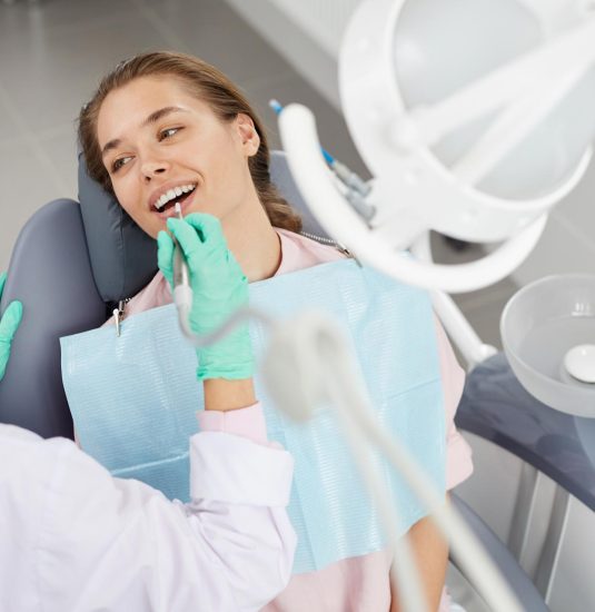 young-woman-at-dental-exam-3XD85GH.jpg